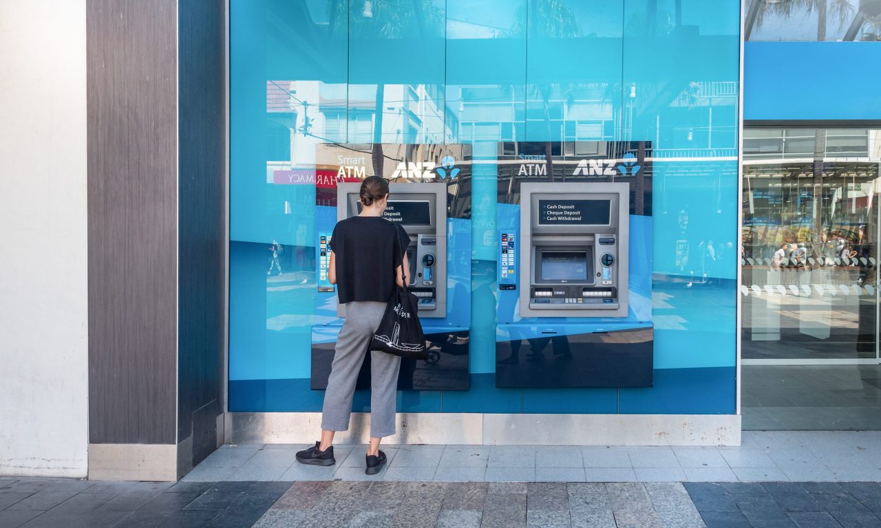Sydney NSW Australia March 28th 2019 - ANZ Cash Machine in Manly The Corso with a client doing transaction in a sunny day of autumn